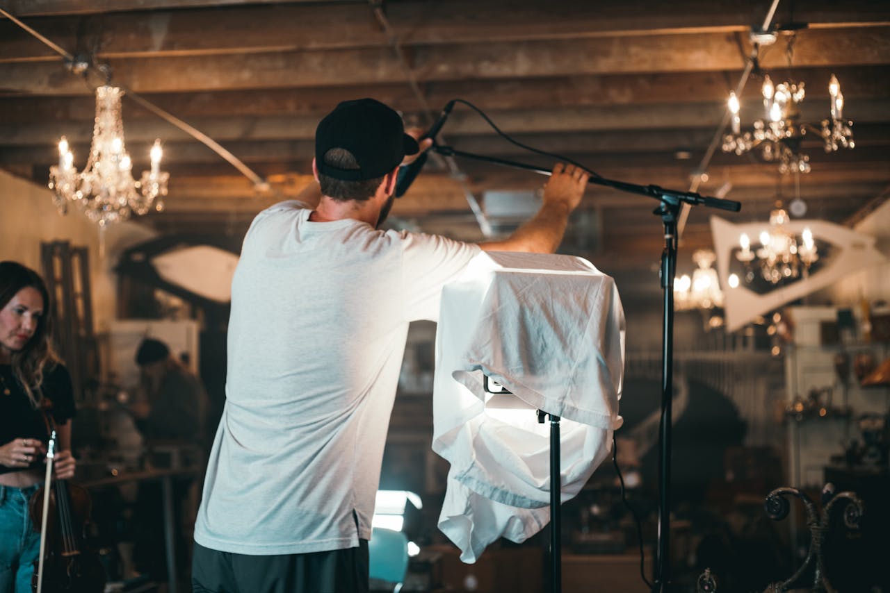 Capturing the dynamic atmosphere of a film set with crew working and adjusting equipment.